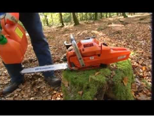 photo of Husqvarna chainsaw on tree stump
