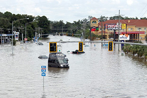 photo of flooded roadway in a downtown area